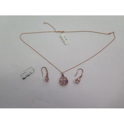 119 - A 9ct rose gold pink multi stone pendant and a pair of 9ct rose gold pink multi stone drop earrings ... 