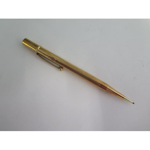 126 - A 9ct yellow gold cased propelling pencil - Length 12cm - approx 23.2 grams - some small denting but... 