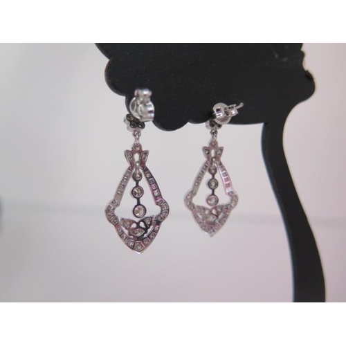 128 - A pair of 18ct white gold diamond drop earrings - approx 31mm x 14mm - diamonds bright and lively