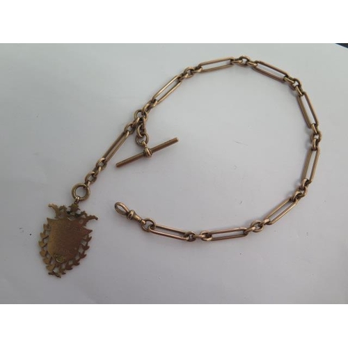 135 - A 9ct yellow gold watch chain with a 9ct medallion fob - Length 34cm - approx weight 35 grams - each... 