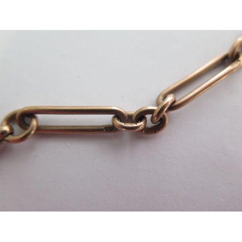 135 - A 9ct yellow gold watch chain with a 9ct medallion fob - Length 34cm - approx weight 35 grams - each... 