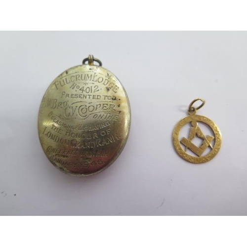 137 - An 18ct yellow gold Masonic fob - Width 22mm - approx weight 4 grams - and a silver masonic Fulcrum ... 