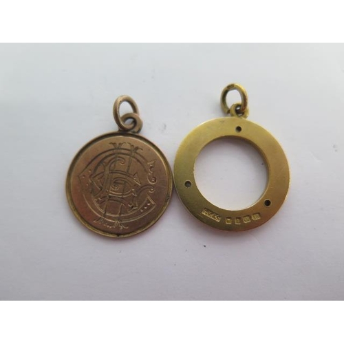 138 - An 18ct yellow gold circular pendant/fob - approx weight 9.6 grams and a 9ct medallion fob - approx ... 