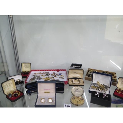 189 - A large collection of cufflinks and tie bars