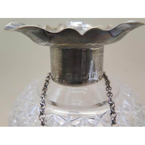 206 - A triform cut glass decanter with a silver rim/pourer and a silver sherry label - Height 26cm - good... 