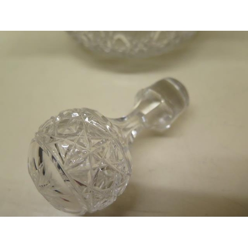 206 - A triform cut glass decanter with a silver rim/pourer and a silver sherry label - Height 26cm - good... 