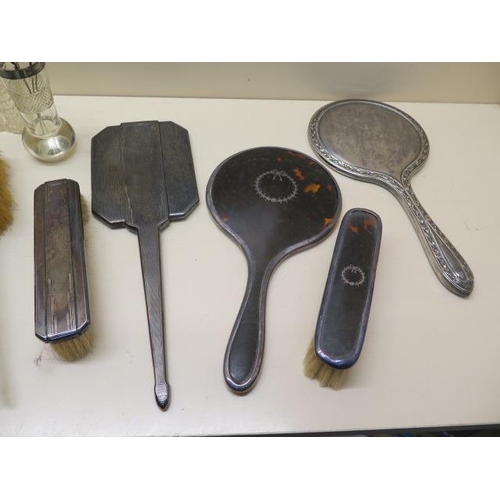 208 - Six silver and tortoiseshell backed dressing table mirrors and brushes, a box and three silver rim b... 