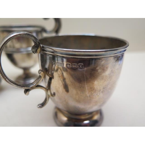 232 - A pair of silver salts, a silver pepper, silver cup, small silver tankard - engraved, two spoons, a ... 