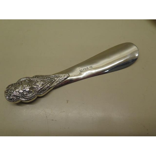 235 - A silver shoe horn, hallmarks for Birmingham 1885/86 - Length 23cm - small dents, old repair otherwi... 