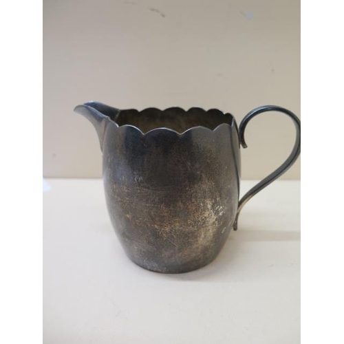 241 - A silver jug - London 1934/35 RWB - Height 9cm - approx weight 7.5 troy oz - small dent to base othe... 