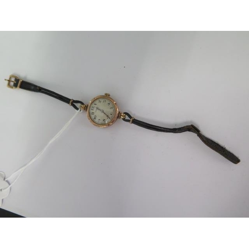 267 - A 9ct yellow gold Rolex manual wind ladies wristwatch on a leather strap - 24mm case - not running -... 