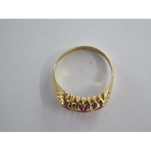 28 - An 18ct yellow gold hallmarked diamond and ruby type five stone ring size N/O - approx weight 2.9 gr... 