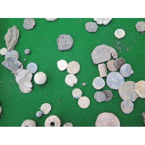 314 - Five Roman coins, assorted lead tokens and artifacts