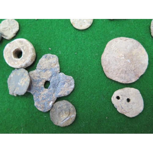 314 - Five Roman coins, assorted lead tokens and artifacts