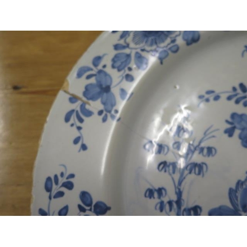 384 - A 19th century blue and white Chinese charger - 38cm diameter - repaired crack and chips to rim, col... 