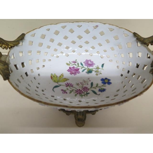 396 - An ormolu mounted porcelain pierced centrepiece - Height 20cm x Width 29cm