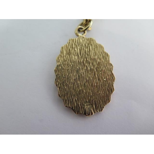 4 - A 9ct yellow gold St Christopher pendant - Height 4cm - on a 9ct 50cm chain - total approx weight 23... 