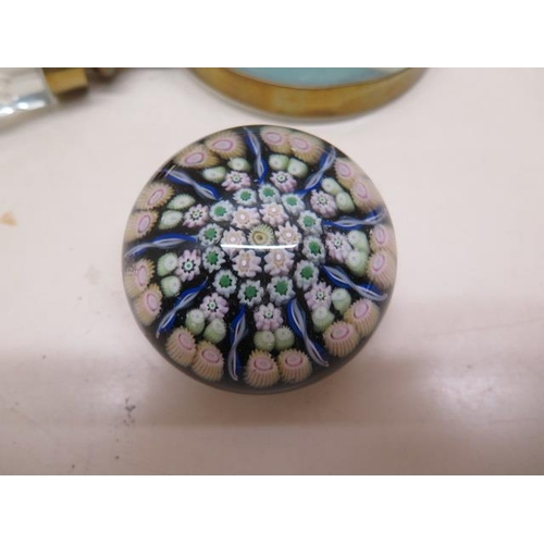 406 - A glass millefiori paperweight - diameter 6cm - and a large glass handle magnifying glass