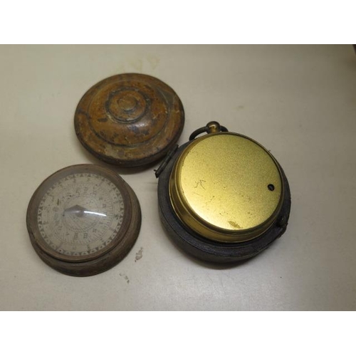 411 - A Norton & Co pocket barometer in part case and a compass in treen box - Width 5.5cm