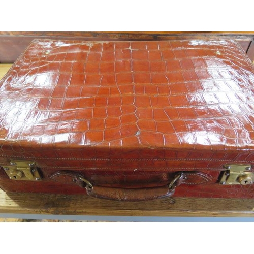 425 - An Edwardian crocodile leather gentleman's vanity case , trunk, by Mappin and Webb , the hinged lid ... 