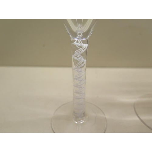 431 - An 18th century spiral twist cordial glass - Height 14cm - and a later champagne glass - both good