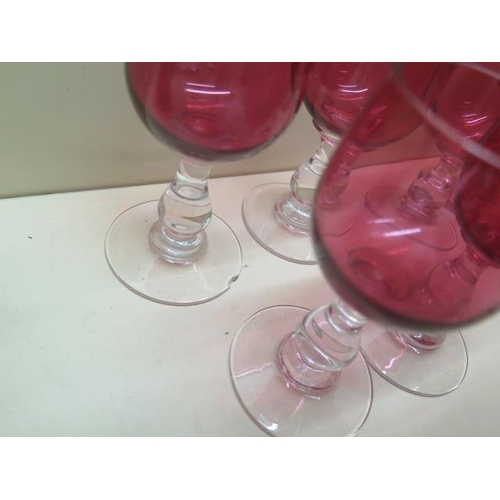 433 - A collection of 16 cranberry wine glasses and two tumblers - all good except one chipped to base