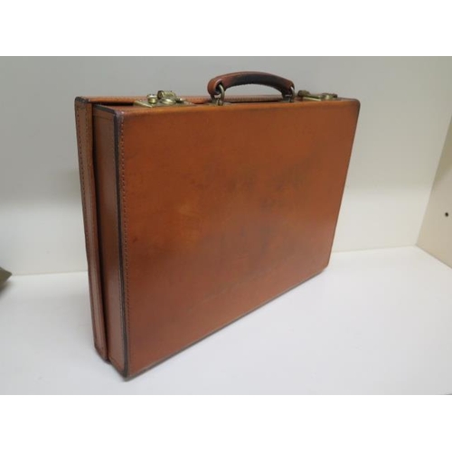 441A - A very good quality tan leather briefcase retailed by by Dugand of Bruxelles possibly by Papworth Lu... 