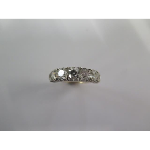 45 - A yellow gold and white metal seven stone diamond ring - the diamonds graduating in size - total dia... 