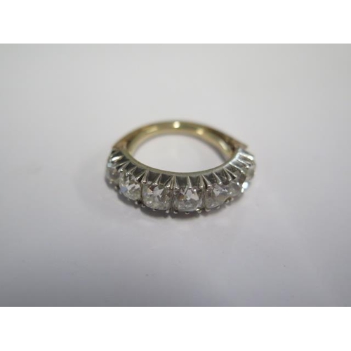 45 - A yellow gold and white metal seven stone diamond ring - the diamonds graduating in size - total dia... 