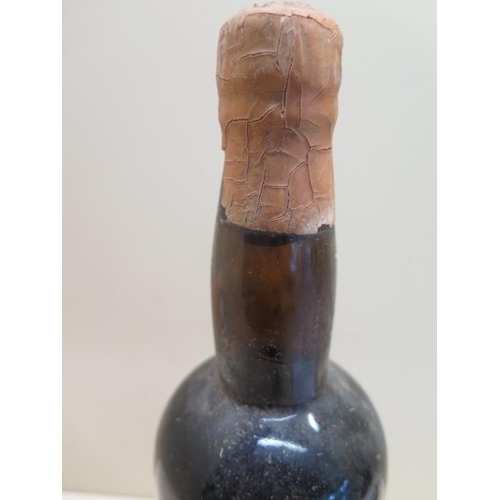 479 - A bottle of Warres & Co Port with an old auction label - level to base of neck, missing label but be... 