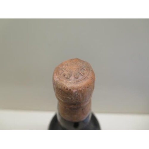 479 - A bottle of Warres & Co Port with an old auction label - level to base of neck, missing label but be... 