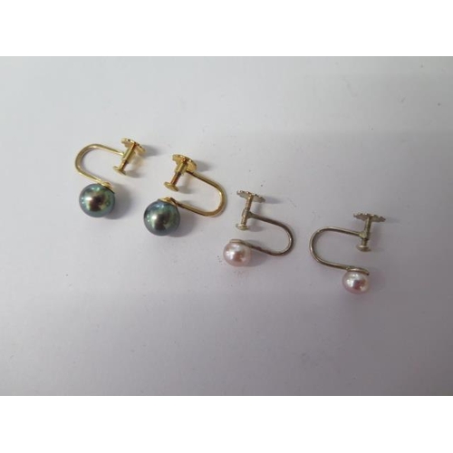 48 - A pair of 9ct screw back black pearl earrings and a pair of silver pearl screw back earrings - both ... 