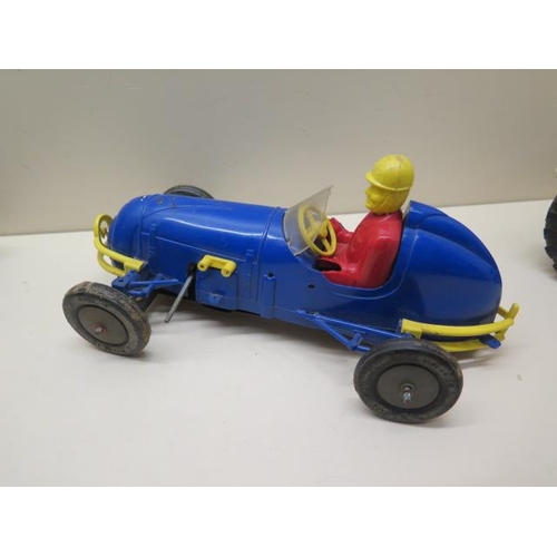 484 - A Gama tinplate battery operated tractor - Length 22cm - a plastic clockwork racing car, a tinplate ... 