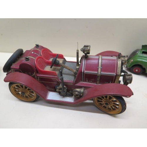 486 - Four Schuco tinplate clockwork cars - Mercer 1225, Ford 1227, Kommando 2000 and Mirakocar 1001 - all... 