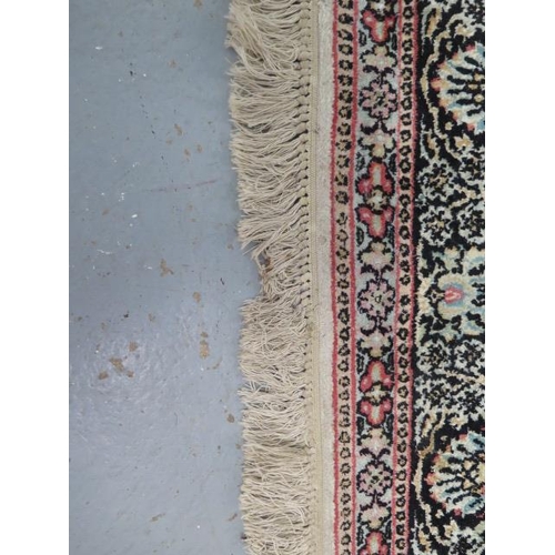 565 - A silk pile rug with a cream field and stylized boarder - 200cm x 120cm - some slight wear but reaso... 