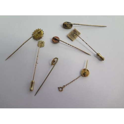 58 - A collection of five 9ct stick pins, a gilt pin and a 15ct pin - total weight approx 11.8 grams