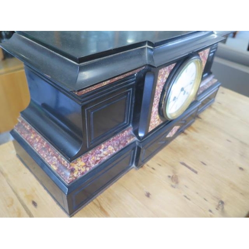 584 - A black slate mantle clock - Width 48cm x Height 23cm - with pendulum