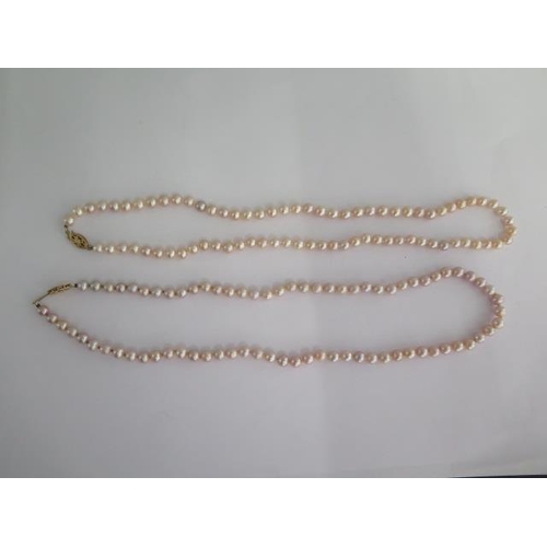 60 - Two 46cm strings of pearls with 9ct clasps