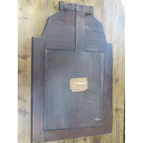 601 - An antique walnut mirror with a reverse painted glass inset top panel - Height 78cm x Width 49cm - t... 