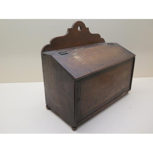 604 - An oak candle box - Height 28cm x 32cm x 16cm