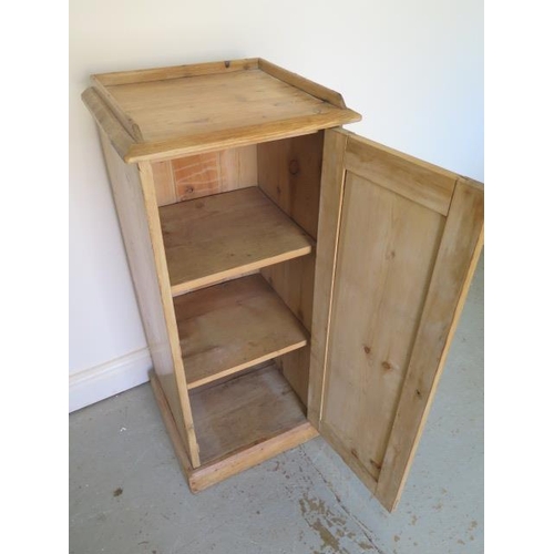 609 - A stripped pine single door cupboard with a shelved interior - Height 92cm x 40cm x 36cm