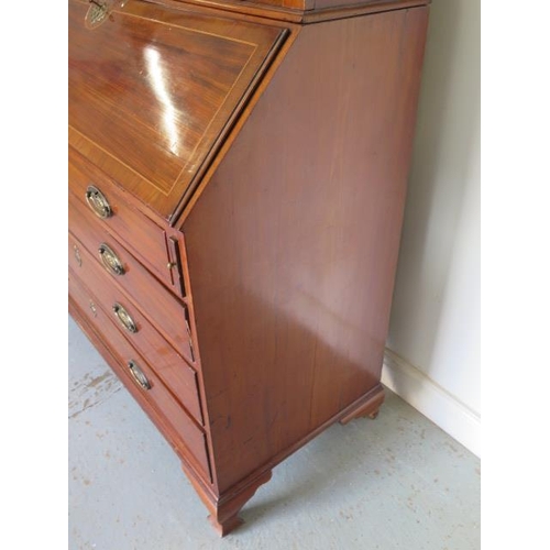 613 - An impressive Georgian mahogany bureau bookcase with a fretwork swan neck pediment, two astragal gla... 