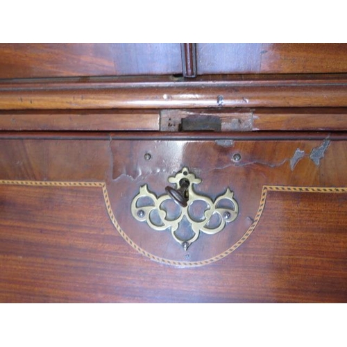 613 - An impressive Georgian mahogany bureau bookcase with a fretwork swan neck pediment, two astragal gla... 