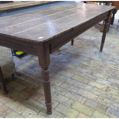 615 - A pine top kitchen table - Height 69cm x 183cm x 74cm