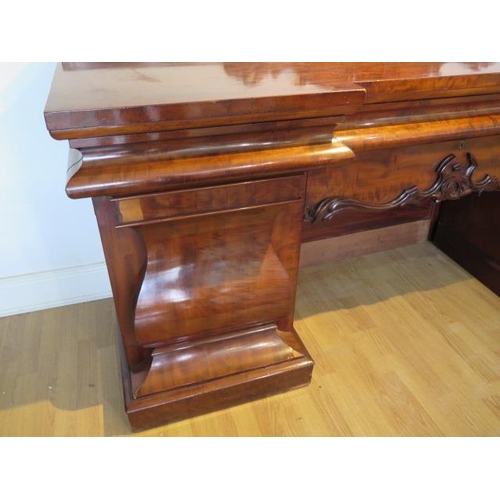 619 - An impressive early 19th century mahogany twin pedestal sideboard with two cupboards and three cushi... 