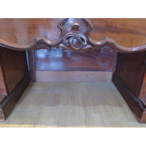 619 - An impressive early 19th century mahogany twin pedestal sideboard with two cupboards and three cushi... 