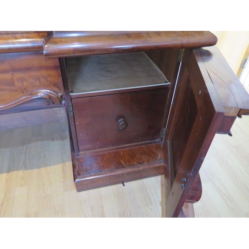 619 - An impressive early 19th century mahogany twin pedestal sideboard with two cupboards and three cushi... 