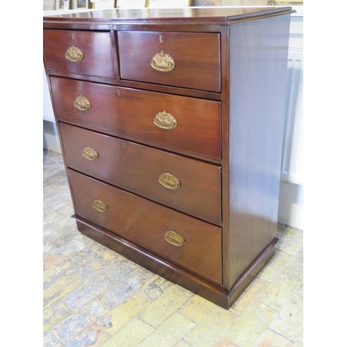 621 - A walnut chest of two over three graduated drawers on a plinth base - in polished and restored condi... 