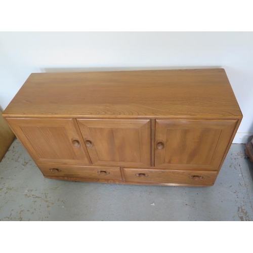 629 - A Ercol elm side cabinet with three doors and two doors with internal cutlery drawer - good conditio... 