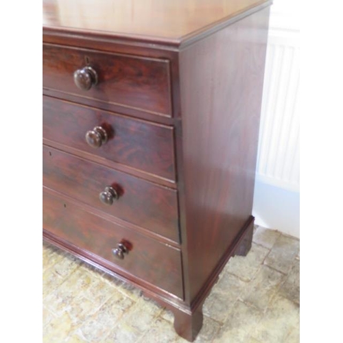 630 - A Georgian mahogany chest of two over three drawers, the cock beaded drawers with bun handles, the c... 